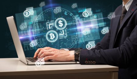 Photo for Business hand working in stock market with crypto exchange icons coming out from laptop screen - Royalty Free Image