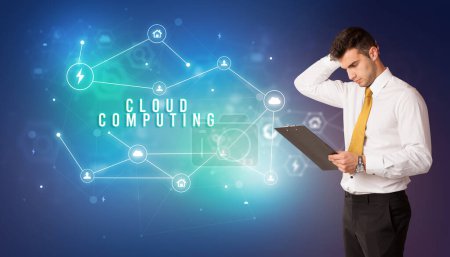 Photo for Businessman in front of cloud service icons with CLOUD COMPUTING inscription, modern technology concept - Royalty Free Image