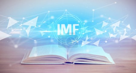 Photo for Open book with IMF abbreviation, modern technology concept - Royalty Free Image