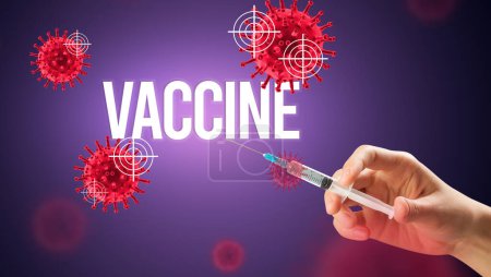 Téléchargez les photos : Vue rapprochée des médecins dans une seringue à gants blancs avec inscription VACCINE, concept d'antidote contre le coronavirus - en image libre de droit