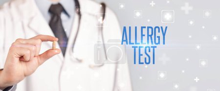 Photo for Close-up of a doctor giving a pill with ALLERGY TEST inscription, medical concept - Royalty Free Image