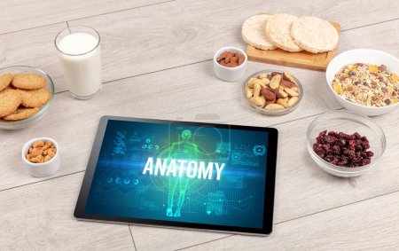 Photo for ANATOMY concept in tablet with fruits, top view - Royalty Free Image