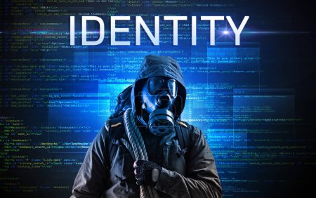 Téléchargez les photos : Hacker sans visage avec inscription IDENTITY sur un fond de code binaire - en image libre de droit