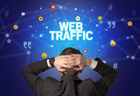 Photo for Rear view of a businessman with WEB TRAFFIC inscription, social networking concept - Royalty Free Image