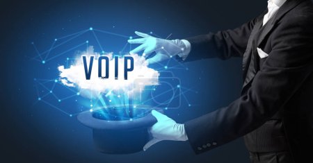 Photo for Magician is showing magic trick with VOIP abbreviation, modern tech concept - Royalty Free Image