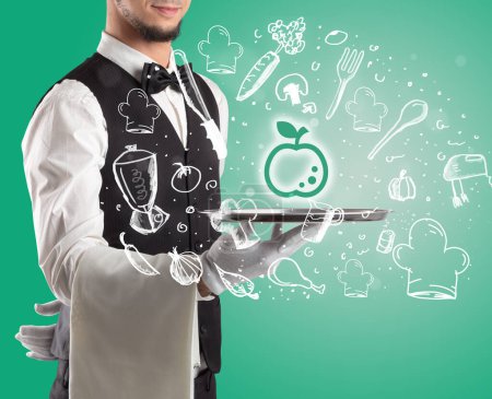 Téléchargez les photos : Waiter holding silver tray with apple icons coming out of it, health food concept - en image libre de droit