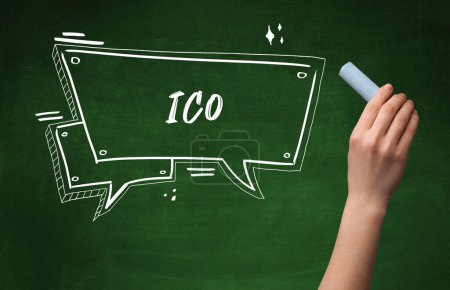 Photo for Hand drawing ICO abbreviation with white chalk on blackboard - Royalty Free Image