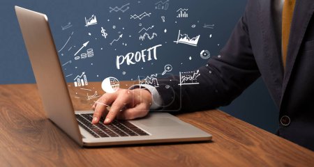 Photo for Businessman working on laptop with PROFIT inscription, modern business concept - Royalty Free Image