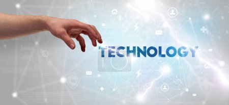 Photo for Hand pointing at TECHNOLOGY inscription, modern technology concept - Royalty Free Image