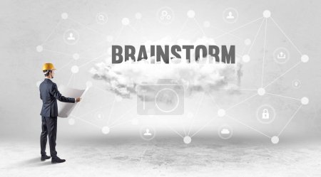 Photo for Engineer working on a social media concept with BRAINSTORM inscription - Royalty Free Image