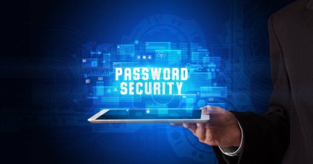 Photo for Young business person working on tablet and shows the digital sign: PASSWORD SECURITY - Royalty Free Image
