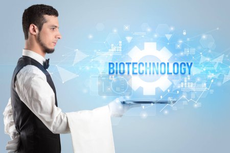 Photo for Waiter serving new technology concept with BIOTECHNOLOGY inscription - Royalty Free Image
