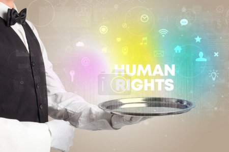 Photo for Waiter serving social networking with HUMAN RIGHTS inscription, new media concept - Royalty Free Image