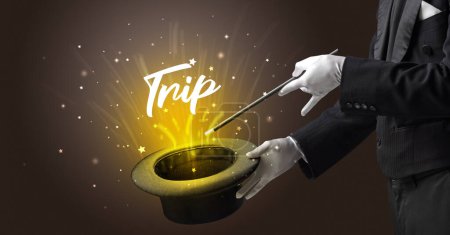 Photo for Magician is showing magic trick with Trip inscription, traveling concept - Royalty Free Image