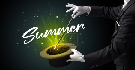 Photo for Magician is showing magic trick with Summer inscription, traveling concept - Royalty Free Image