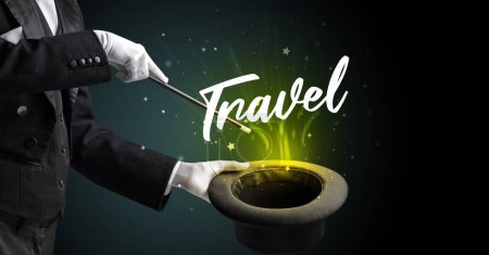 Photo for Magician is showing magic trick with Travel inscription, traveling concept - Royalty Free Image