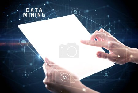 Photo for Holding futuristic tablet with DATA MINING inscription, cyber security concept - Royalty Free Image