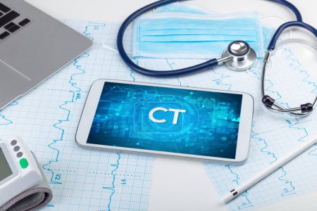 Photo for Close-up view of a tablet pc with CT abbreviation, medical concept - Royalty Free Image