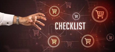 Photo for Close-Up of cropped hand pointing at CHECKLIST inscription, online shopping concept - Royalty Free Image