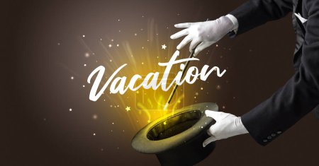 Photo for Magician is showing magic trick with Vacation inscription, traveling concept - Royalty Free Image