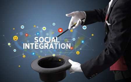 Photo for Magician is showing magic trick with SOCIAL INTEGRATION inscription, social media marketing concept - Royalty Free Image