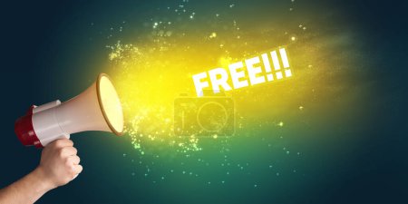 Photo for Young woman yelling to loudspeaker with FREE inscription, modern media concept - Royalty Free Image