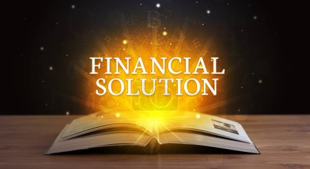 Photo for FINANCIAL SOLUTION inscription coming out from an open book, educational concept - Royalty Free Image