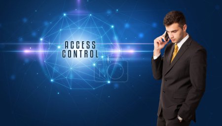 Photo for Businessman thinking about security solutions with ACCESS CONTROL inscription - Royalty Free Image