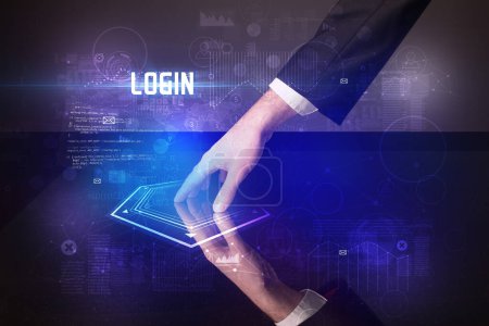 Téléchargez les photos : Table numérique tactile à la main avec inscription LOGIN, concept de sécurité new age - en image libre de droit