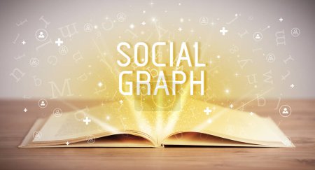 Téléchargez les photos : Livre ouvert avec inscription SOCIAL GRAPH, concept de médias sociaux - en image libre de droit