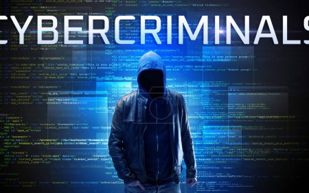 Photo for Faceless hacker with CYBERCRIMINALS inscription on a binary code background - Royalty Free Image