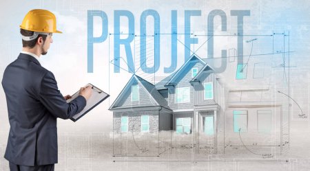 Foto de Joven ingeniero sosteniendo plano con inscripción PROYECTO, concepto de planificación de la casa - Imagen libre de derechos