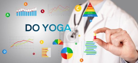Photo for Nutritionist giving you a pill with DO YOGA inscription, healthy lifestyle concept - Royalty Free Image