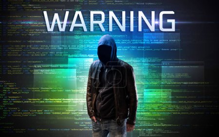 Téléchargez les photos : Hacker sans visage avec inscription AVERTISSEMENT sur un fond de code binaire - en image libre de droit