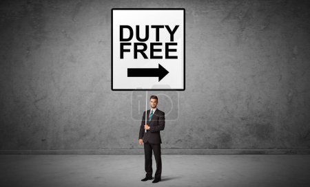 Photo for Business person holding a traffic sign with DUTY FREE inscription, new idea concept - Royalty Free Image