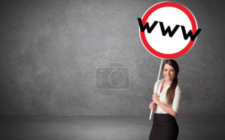 Photo for Young business person holdig traffic sign with WWW abbreviation, technology solution concept - Royalty Free Image