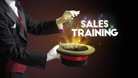Photo for Illusionist is showing magic trick with SALES TRAINING inscription, new business model concept - Royalty Free Image