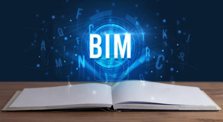BIM inscription coming out from an open book, digital technology concept