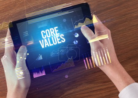 Photo for Close-up of hands holding tablet with CORE VALUES inscription, modern business concept - Royalty Free Image