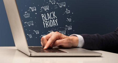 Photo for Businessman working on laptop with BLACK FRIDAY inscription, online shopping concept - Royalty Free Image
