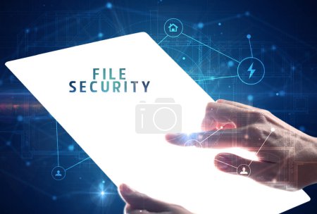 Photo for Holding futuristic tablet with FILE SECURITY inscription, cyber security concept - Royalty Free Image