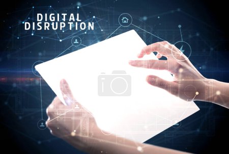 Photo for Holding futuristic tablet with DIGITAL DISRUPTION inscription, cyber security concept - Royalty Free Image