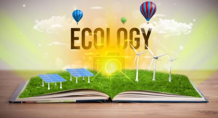 Foto de Libro abierto con inscripción ECOLOGIA, concepto de energía renovable - Imagen libre de derechos