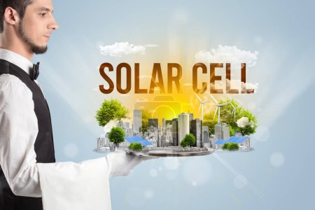Photo for Waiter serving eco city with SOLAR CELL inscription, renewabke energy concept - Royalty Free Image
