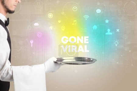 Photo for Waiter serving social networking with GONE VIRAL inscription, new media concept - Royalty Free Image