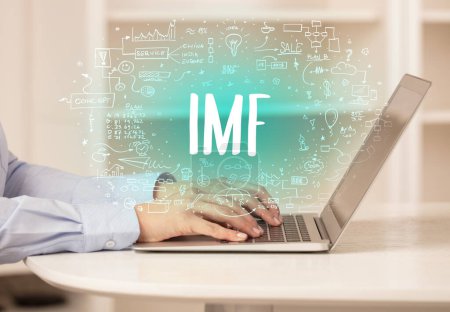 Téléchargez les photos : Main travaillant sur un nouvel ordinateur moderne avec l'abréviation FMI, concept de technologie moderne - en image libre de droit