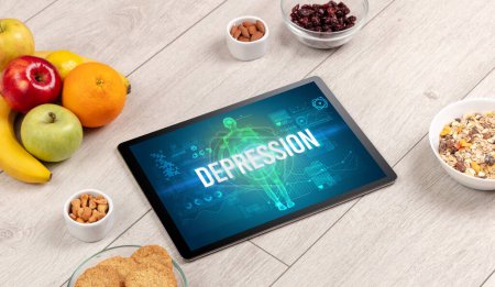 Photo for DEPRESSION concept in tablet with fruits, top view - Royalty Free Image