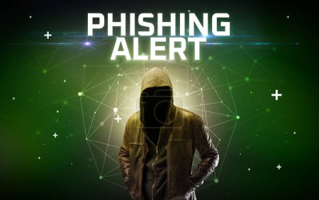 Téléchargez les photos : Mystérieux hacker avec inscription PHISHING ALERT, inscription de concept d'attaque en ligne, concept de sécurité en ligne - en image libre de droit