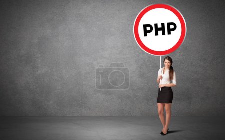 Photo for Young business person holdig traffic sign with PHP abbreviation, technology solution concept - Royalty Free Image