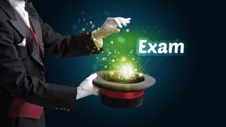 Photo for Magician is showing magic trick with Exam inscription, educational concept - Royalty Free Image